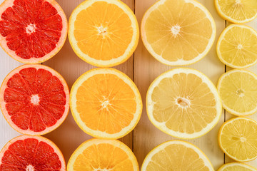 Fototapeta na wymiar Orange, Grapefruit, Lemon And Lime Citrus Fruit Slices On Table