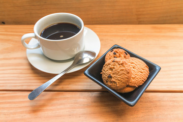 Chocolate chips cookies with white cup of coffee 1