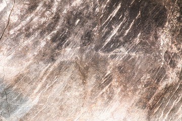 Closeup of the texture of old and weathered flat  nature stone