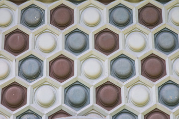 Old and weathered round in the hexagon pattern