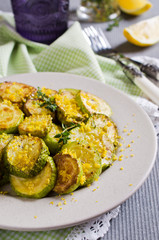 Fried zucchini with lemon zest