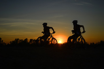Fototapeta na wymiar mountain bike ,twilight, people, action,