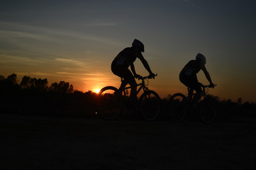 Obraz premium mountain bike ,twilight, people, action,