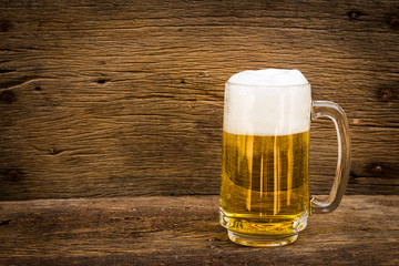 Beer in glass on wood table