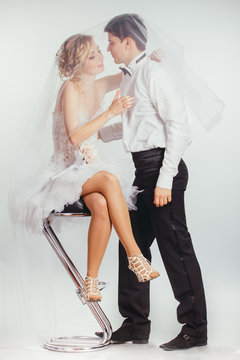 couple of bride and groom covered with veil