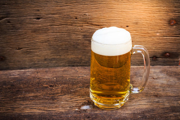 Beer in glass on wood table