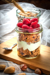 Muesli with yogurt and raspberries.