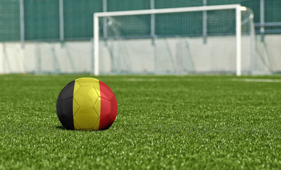 Soccer ball on the green field- flag Belgium