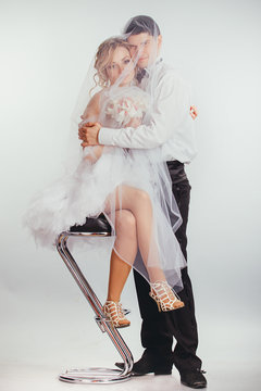 couple of bride and groom covered with veil