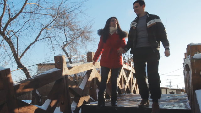Lovers couple walking on the bridge
