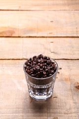 Fototapeta na wymiar Coffee grains in a glass