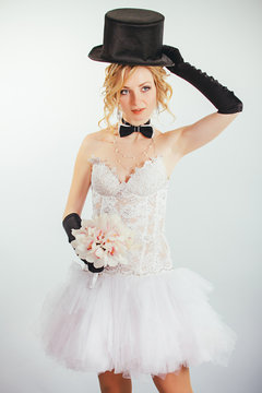blonde bride in tophat with veil and long black gloves