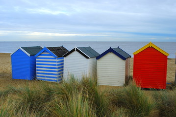 Colorful beach huts in British seaside