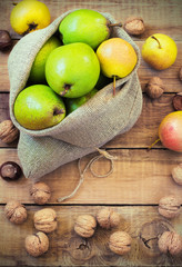 Autumn composition of fruits, nuts and spices - pears, walnuts, maple leaves