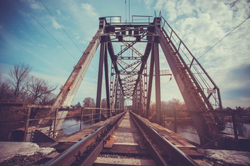 Fototapeta na wymiar Looking straight down a train bridge 