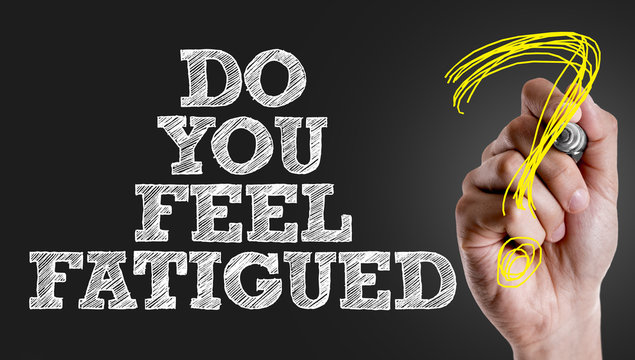Hand writing the text: Do You Feel Fatigued?