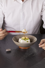 Japanese tofu, Japanese soft cold tofu with sauce in a dish on dining table