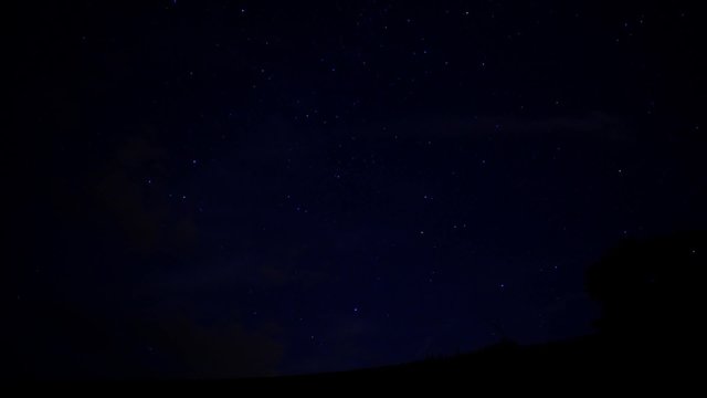night sky with stars and light trails - time lapse