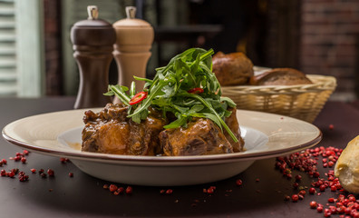 beef tails stew with wine and vegetables 
