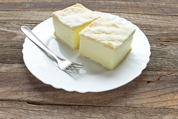 Cream pie with layers of puff pastry in plate