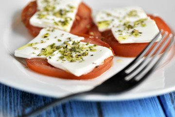 tomato and cheese, dressed with olive oil and oregano