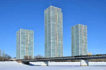 Obraz na płótnie Canvas Street view in Astana, Kazakhstan, in winter, with residential towers called GRAND ALATAU