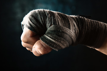 Close-up hand of muscular man with bandage