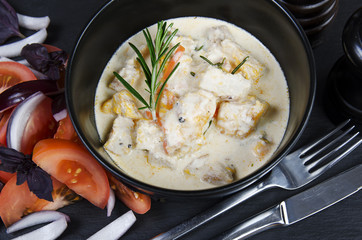 Braise fillet slices of chicken in a creamy s
