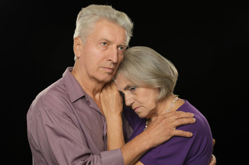 Sad elderly couple