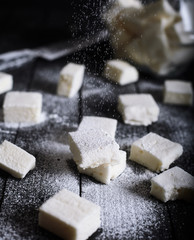 Honey marshmallows on a black background