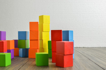 Colorful stack of wood cube building blocks