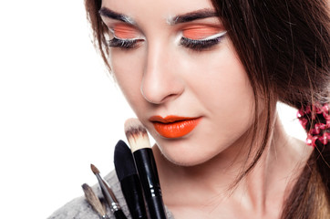 Obraz premium Woman with make-up brushes