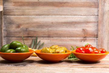 Tapas bowls with giant olives and cherry tomatoes