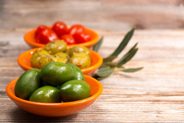 Tapas bowls with giant olives and cherry tomatoes