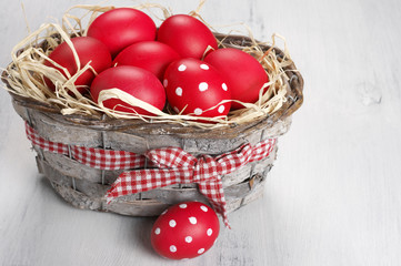 Red Easter eggs in basket