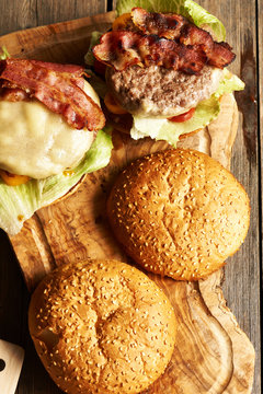 Home made cheeseburgers on wooden table