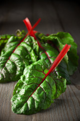Swiss chard on wood