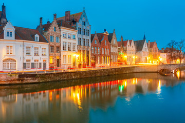 Fototapeta na wymiar Scenic city view of Bruges canal with beautiful medieval colored houses, bridge and reflections, Belgium