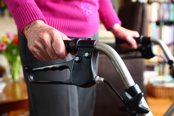 hands/ hands of an old woman on a walker