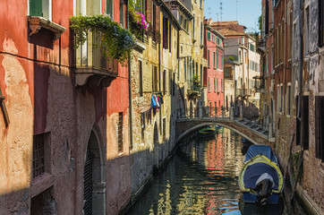 Venice street with boat and bridge