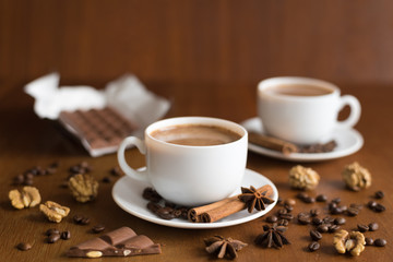 Two coffee cups and chocolate