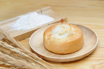 Fototapeta na wymiar coconut bun on wooden dish