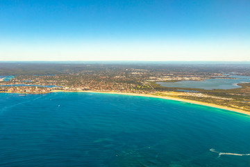 Fototapeta na wymiar Aerial view of Bate Bay, Sydney, New South Wales, eastern Australia. The beaches of Cronulla: Wanda Beach, Elouera Beach, North Cronulla Beach, Cronulla Beach, Blackwoods Beach and Shelly Beach.