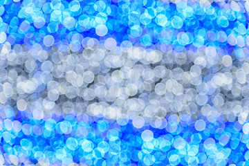 Blue ans white abstract bokeh lights. defocused background