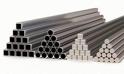 Metal pipes of different diameters and shapes stacked in a pyramids isolated on white background  