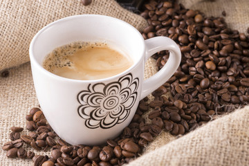 Coffee cup and beans.