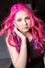 Naklejka premium The young girl with pink hair