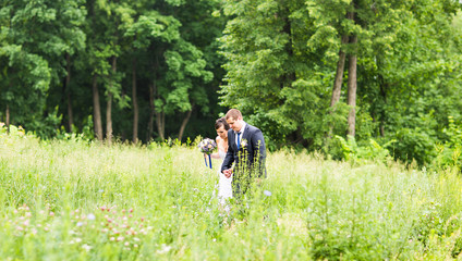 Fototapeta premium Happy bride and groom on their wedding day