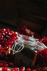 Pomegranate Jam, fresh pomegranate, dark wood background, select