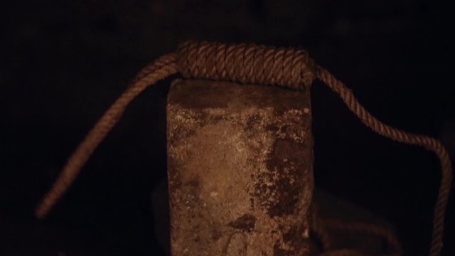guillotine, lace falls on stone